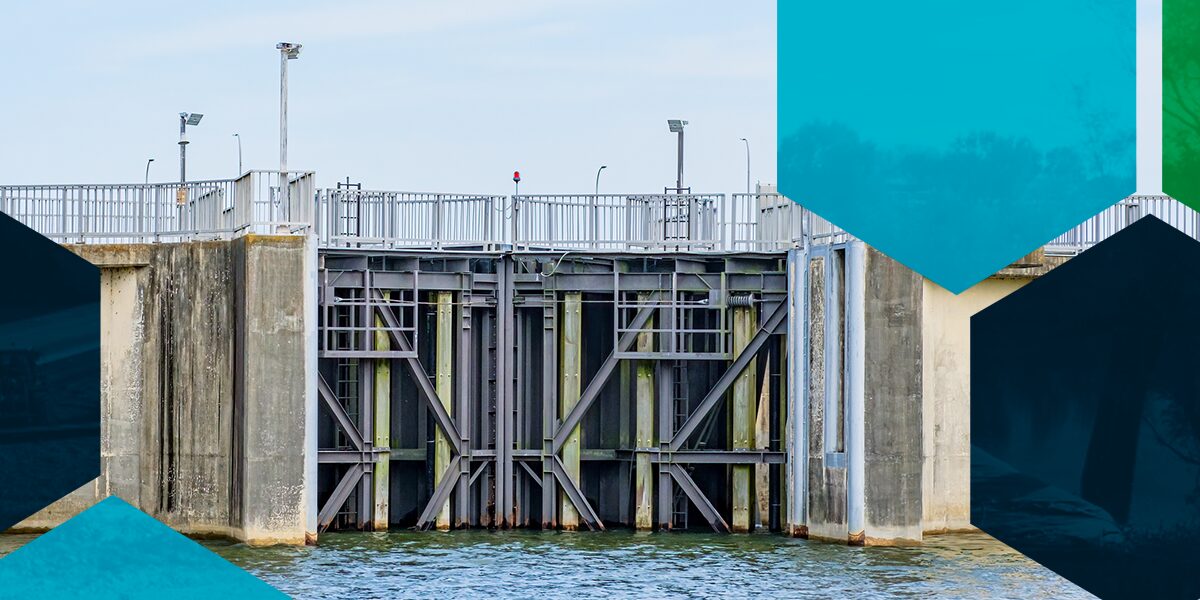 Large metal dam as a flood control initiative.