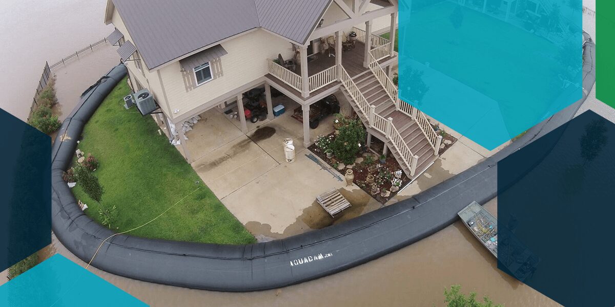 A temporary flood barrier to protect a house from flooding by Aqua Dam.