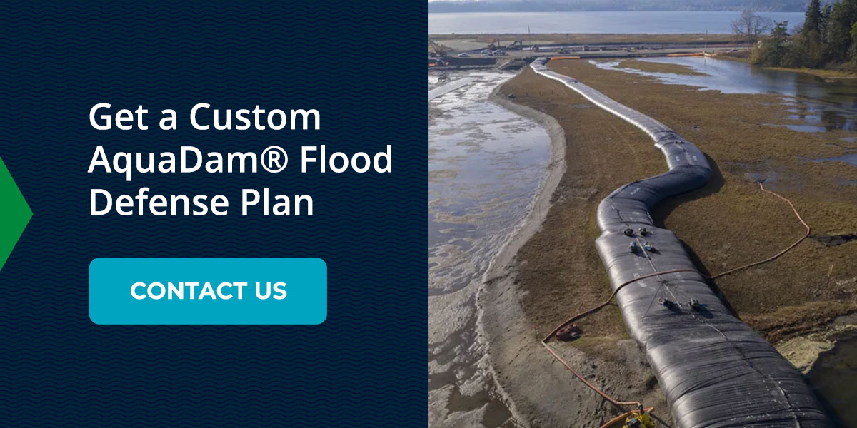 Water filled flood barrier stopping floods with AquaDam. Contact them to get a custom flood defense plan.